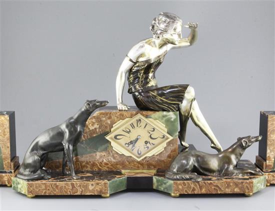 Uriano. An Art Deco bronze spelter and marble clock garniture, width 25in. height 17in.